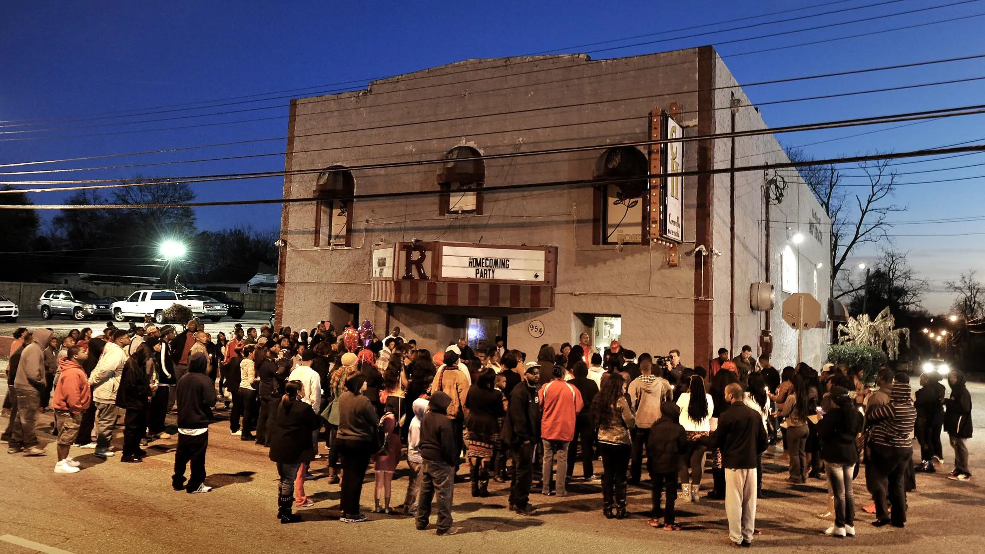 Crowd gathered around the threatened building